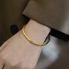 Elegant Non-Fading Gold Ethnic Bangle for Women - Simple Titanium Steel Bracelet Jewelry