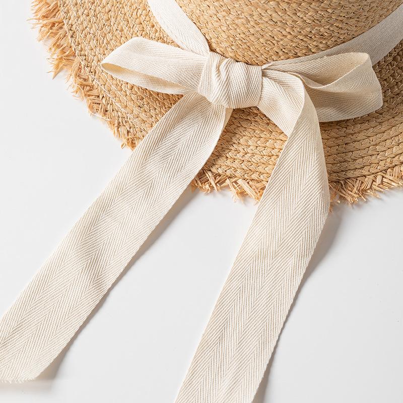Korean version of elegant flat-top raffia straw hat for women's summer small fresh bow holiday beach big-brimmed sun hat