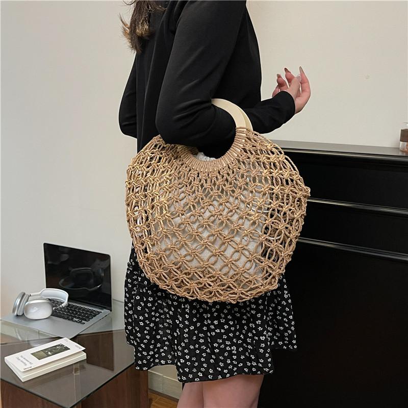 Heutige beliebte hohle gewebte Tasche im Urlaubsstil, neue trendige Damen-Sommerhandtasche mit großem Fassungsvermögen und vielseitig einsetzbar
