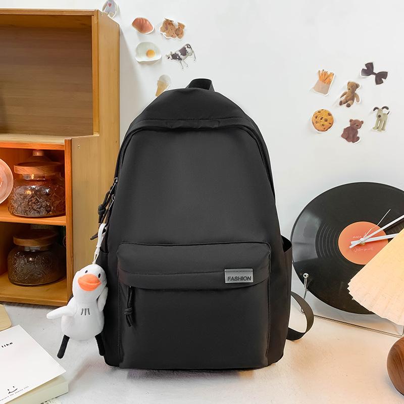 

Casual backpack men s simple large-capacity solid color junior high school college student schoolbag women s durable computer backpack fashion чорний