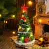 Leuchtender Weihnachtsbaum mit Spieluhr als Zimmerdekoration