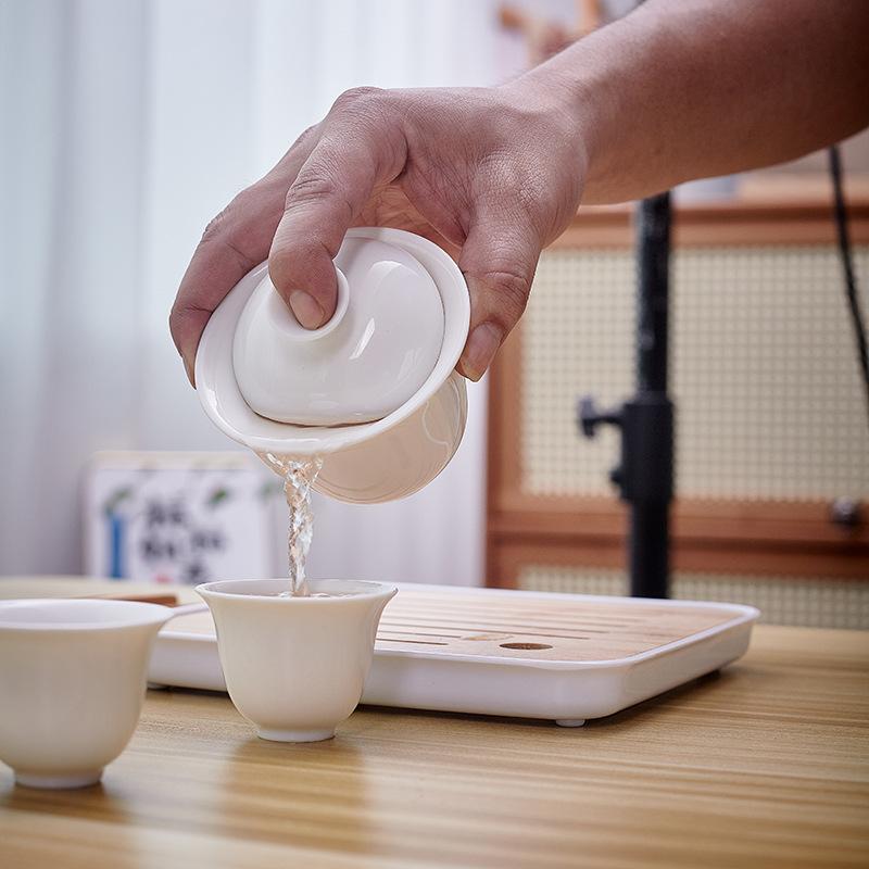 Dehua white porcelain tea set, practical ceramic cover bowl, one pot, four cups, outdoor storage, travel convenience bag, business small gifts