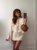 European & American Women's Fashion Tie-Up Cutout Patchwork Two-Piece Set: Round Neck Long Sleeve Top & Mini Skirt for Vacation or Casual Wear.
