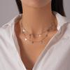 Light Luxury Stainless Steel Starburst Tassel Necklace: High-End Double Layer Clavicle Chain for Women's Fashion
