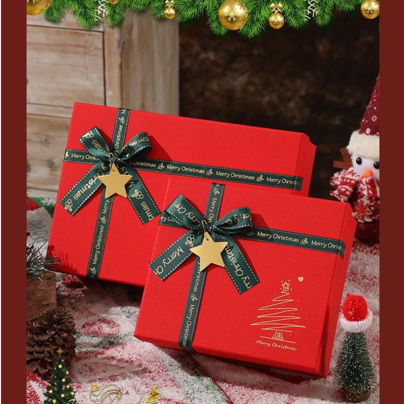 Red Christmas Gift Box With Shiny Surface Green Ribbon Gold Star Ornament Ideal For Holiday Gift Wrapping