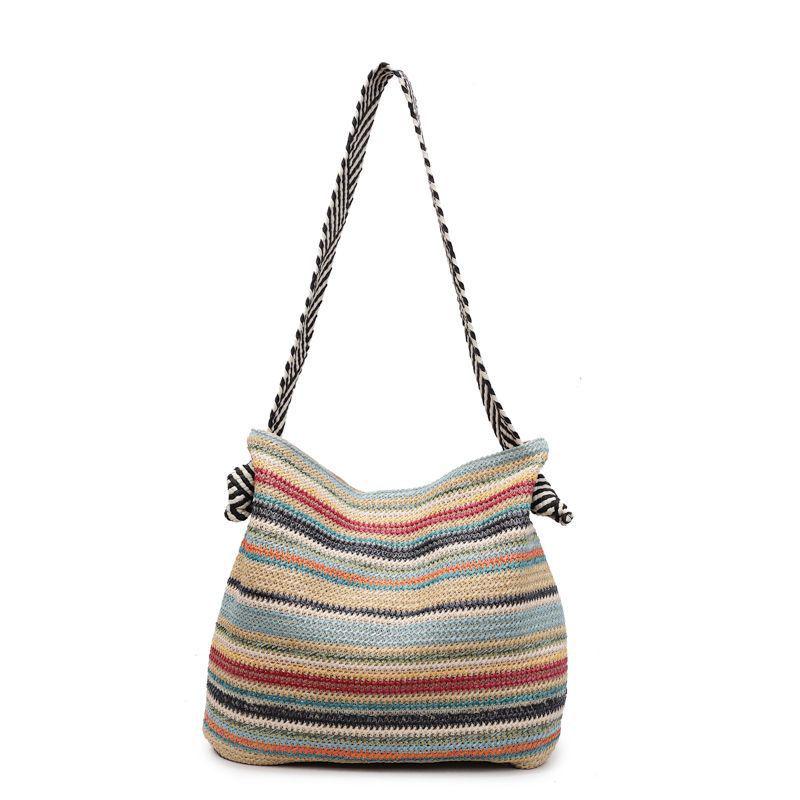 Hollow Straw Woven Tote: Fashionable, Large Capacity Shoulder & Handheld Bag for Seaside Vacation or Commute.
