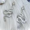 Celestial Silver Snake Earrings - Mysterious and Smooth Design