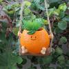 Creative Multifunctional Orange Swing Planter Pot With Swing Feature Suitable for Kids Entertainment and Home Gardening