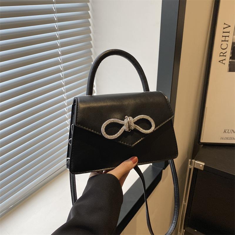 Simple and popular versatile solid color bow sewing line women's bag fashionable oblique span shoulder handbag