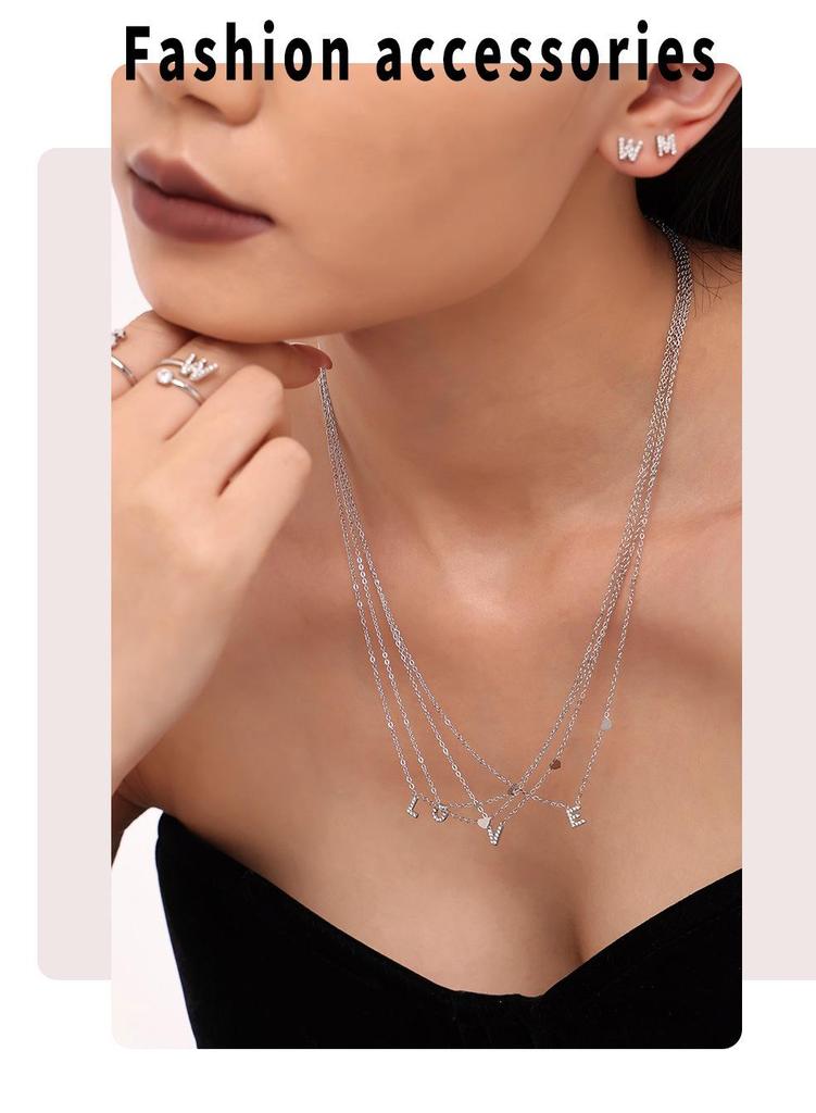 Oumeika Titanium Steel Jewelry Set: 26 Zircon-Inlaid Letters, PVD Gold-Plated Necklace, Bracelet, Earrings, and Ring.