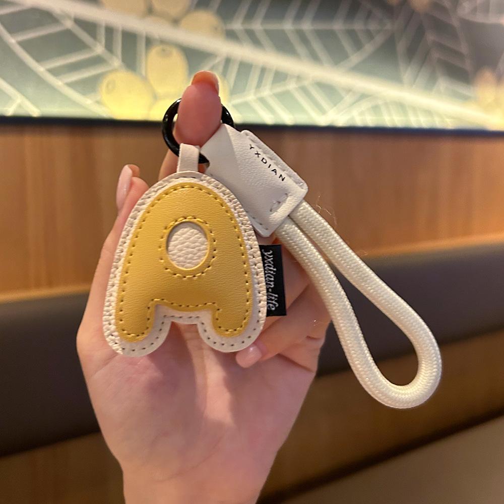

A To Z Leather Initials Keychain Braied Wristband Pendant Keyring for Women Men Car Bag Charms Camera Phone Case Accessories