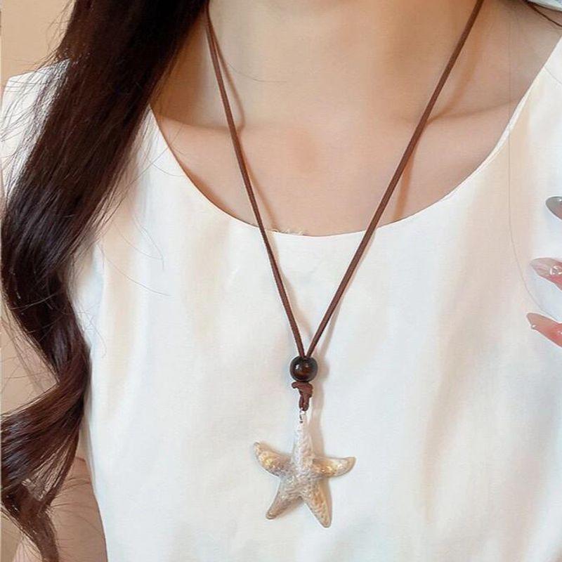

Приморский отпускной стиль Ожерелье из ракушек морской звезды и жемчуга для женщин 2025 Новое поступление Преувеличенное ожерелье на ключицу Островное ожерелье Украшение Starfish Necklace Free Strap ~