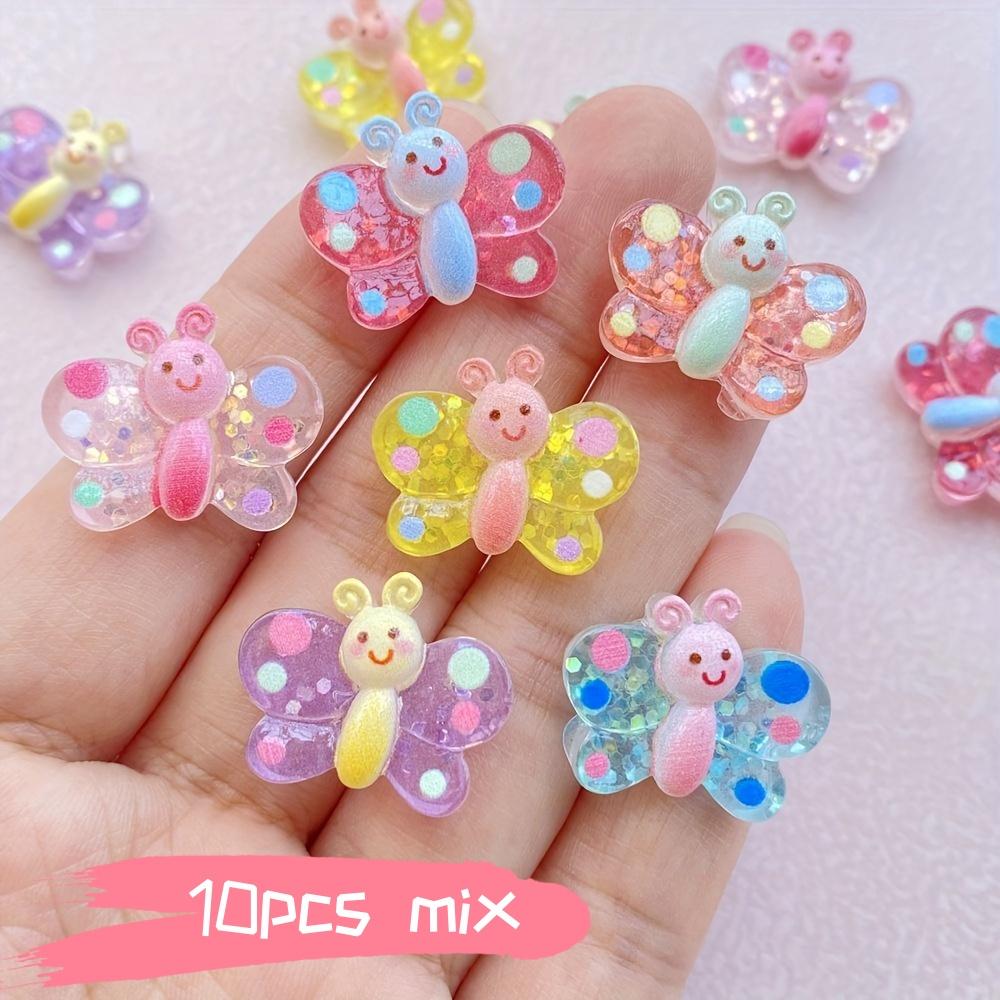 

Vibrant Butterflies: Set of 10 vibrant resin butterfly ornaments | Colorful, glittery mini figurines with friendly faces | Perfe