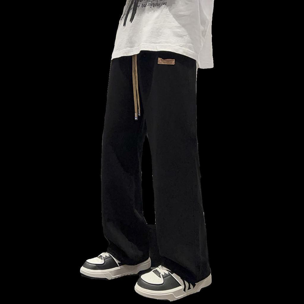 Czarne jeansy męskie z szerokimi nogawkami: Spodnie młodzieżowe z prostymi nogawkami jesień/zima 2024