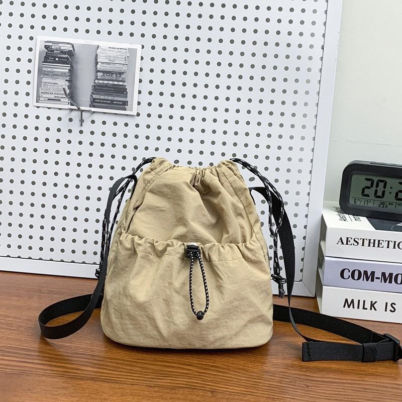 Simple trendy brand small satchel women's lightweight nylon mobile phone bag lazy pleated drawstring messenger bag men's shoulder bag