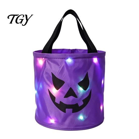 Halloweenowe Torby na Cukierki i Psikusy Świecąca Dynia Torba na Cukierki Wiaderko z Podświetleniem LED Uchwyty dla Maluchów Wielokrotnego Użytku Wodoodporna Torba Tote z Tkaniny Oxford z Uchwytem
