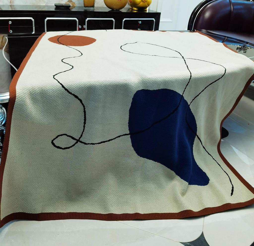 Boho pletená vlněná pohovka a postelová deka