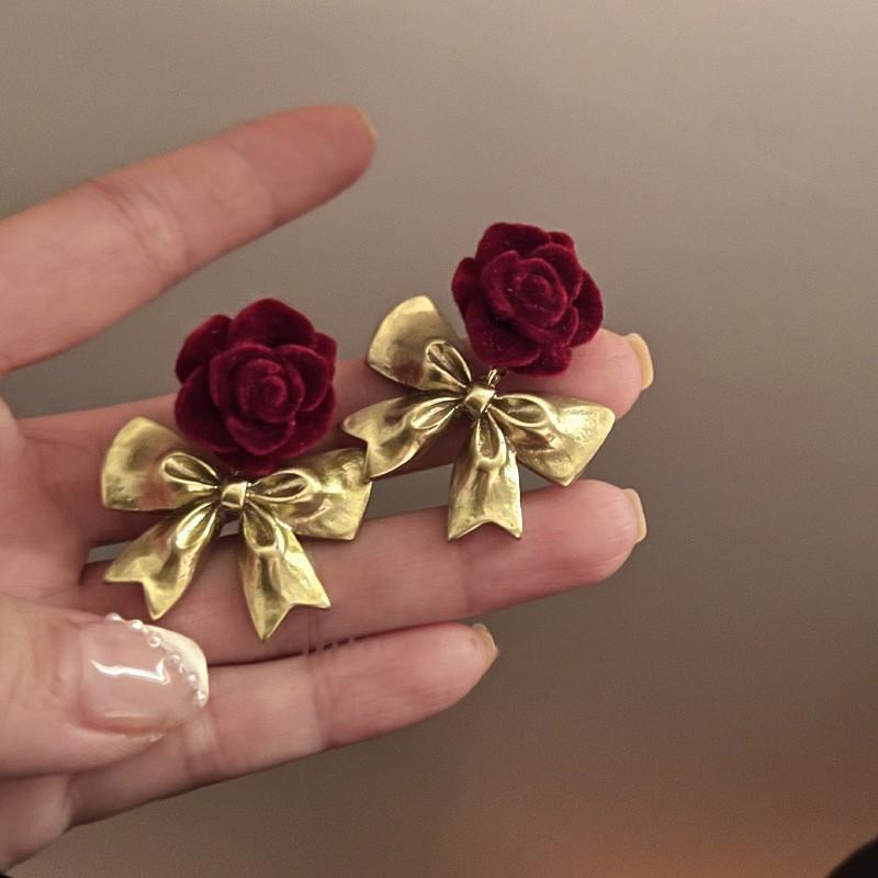 Electroplated flower pearl flocking earrings temperament versatile stud earrings women s earrings wholesale