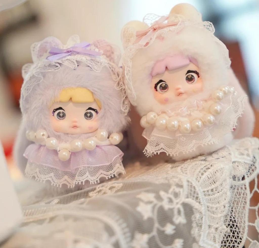 Nommi Plush Mascot Keychain Blind Box Fluffy Exterior Rigid Interior for Standing Includes 3 Rotating Perfect as a Bag Charm or Tabletop Decor 8 Types