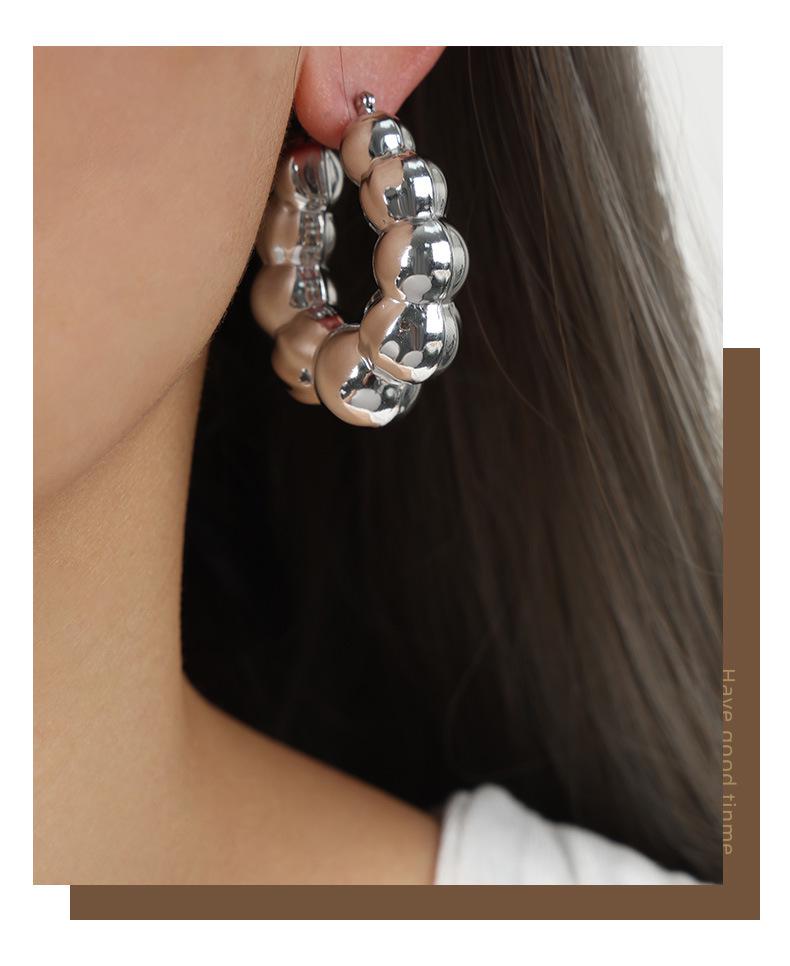 Textured Gold-Plated Titanium Steel U-Shaped Earrings with Steel Ball Design