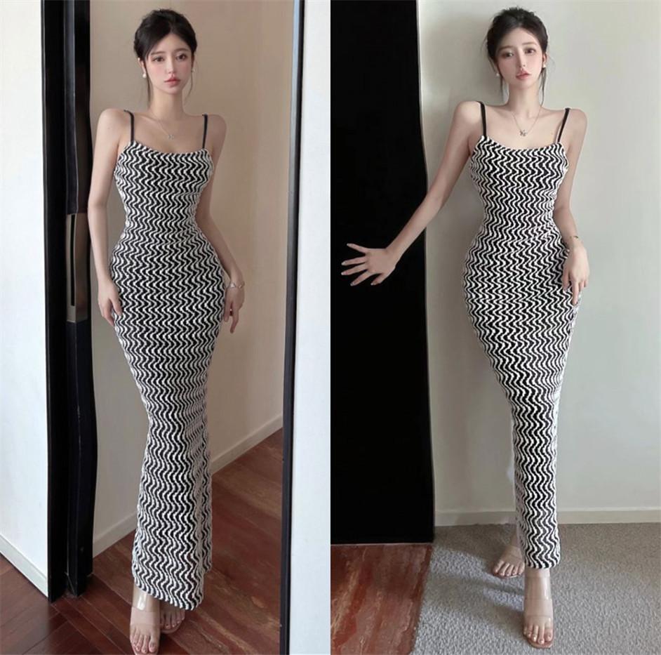 European and American style sexy suspender dress women's early autumn new corrugated abstract tight and thin backless long skirt