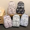 Jugendrucksack mit Sanrio Kuromi Süßes Schleifenmuster für den Campus