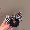 Age-Reducing Black & White Plaid Bow Hair Tie