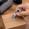 Key Holder Tool for Packages and Drink Bottles with a Single Metal Body and Carry Hole for Everyday Use on Key Hardware, a Pack, or a Belt