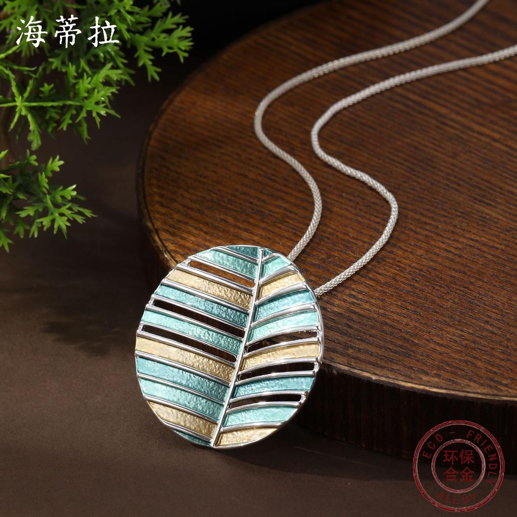 Nouvelle couleur émail creux rond géométrique feuille long pendentif personnalité femme collier long feuille ronde