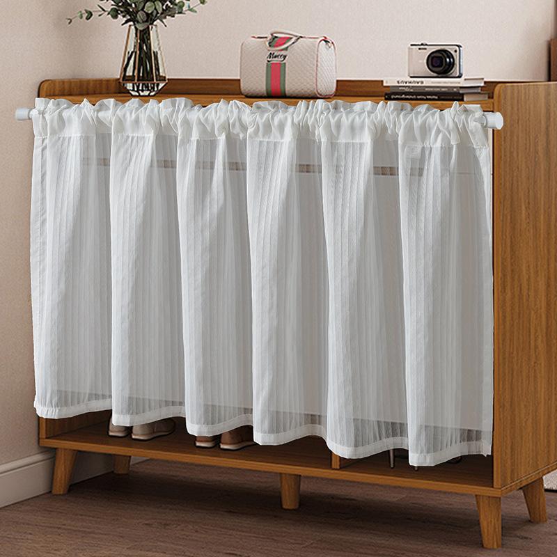 

Vertical slatted blinds cover the kitchen, bedroom and small curtains. 1