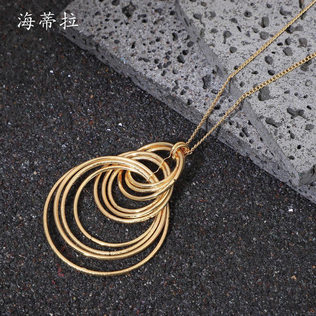 New Geometric Ring Stacked Long Sweater Chain, Fashionable and High-end Women's Versatile Ring Long Pendant