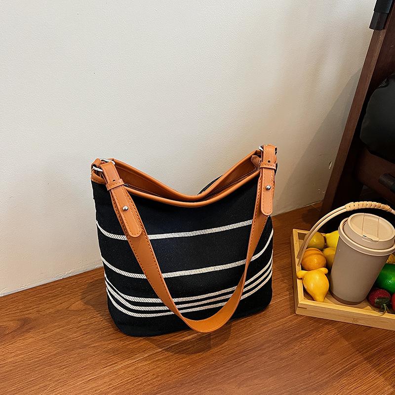 

Casual summer small bag women s new light luxury simple canvas oblique span bag shoulder tote bucket bag синий
