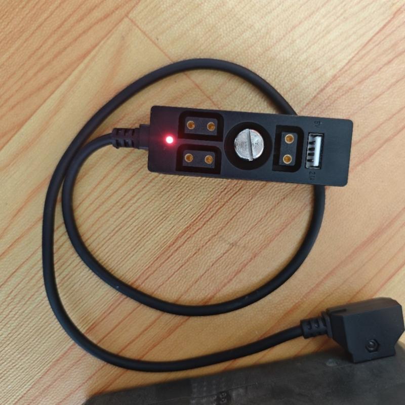 Multiple Device Battery Converter Cord Featuring USB Output and Monitoring Light