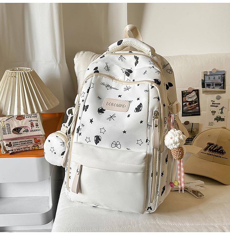 Cartable grande valeur petit frais doux fille sac à dos mignon dessin animé sac à dos grande capacité collège étudiant sac d'école