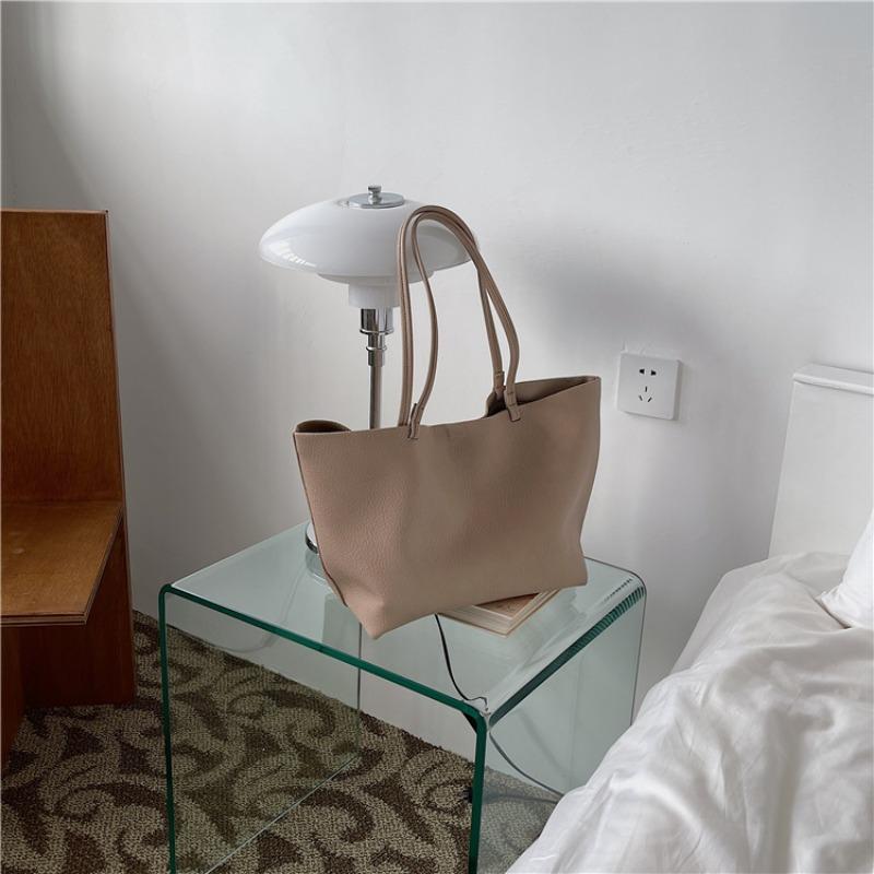 

Мягкая кожаная портативная сумка-тоут большой вместимости, высококлассная сумка через плечо с логотипом для ребенка и матери, модная нишевая женская сумка для通勤 абрикосовый