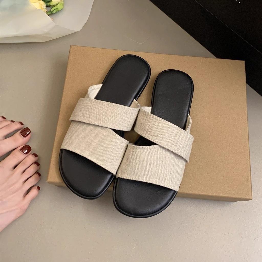 Flat-bottomed slippers women's summer wear new simple casual lazy seaside vacation wind one-word beach shoes
