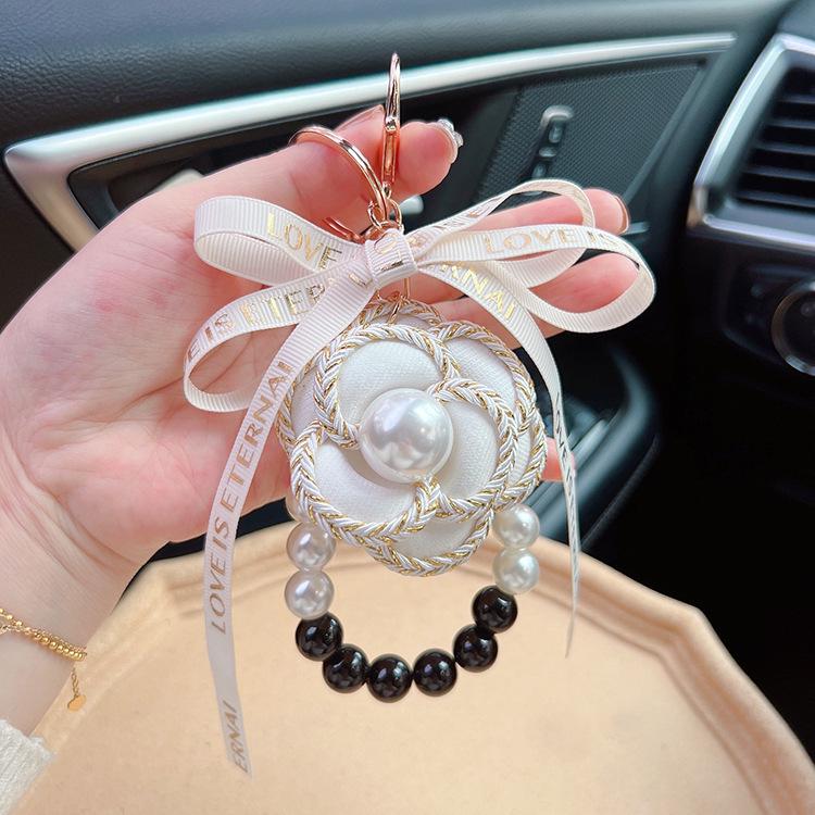 Elegant Black & White Pearl Camellia Keychain with Bow - Stylish Korean Flower Bag Charm