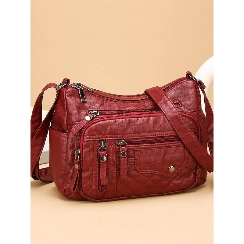 Dámská měkká kožená taška s mnoha oddíly a více kapsami, prošíváním na jednom rameni