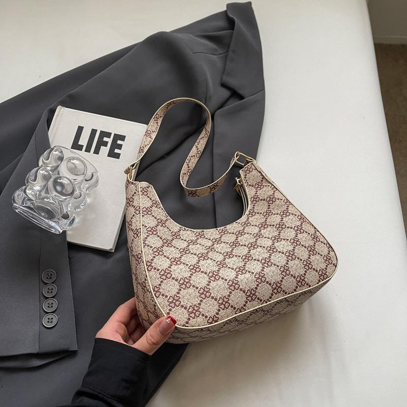 

Нова модна літня 2024 року сумка в формі півмісяця. Проста сумка на плече. Повсякденна приміська сумка під пахвами. Ретро-сумка для жінок. коричневий