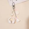Creative Headphones Badminton Racket Sports Keychain Suitable for Music Fans and Sports Lovers Featuring Unique Design