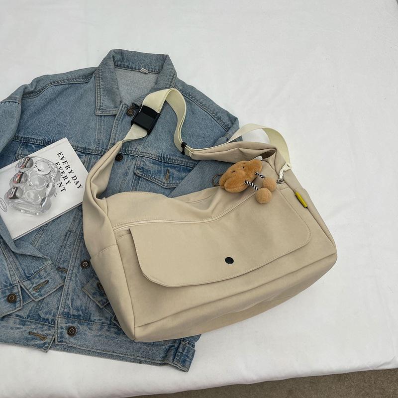 

Tooling messenger bag women s 2025 new shoulder bag Hong Kong style large capacity trend leisure bag tide student class backpack Without pendant бежевый