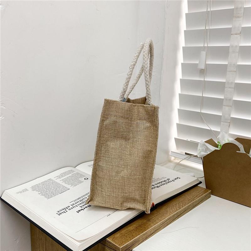 Cute hand-held lunch box lunch bag for women 2025 new Korean version ins student versatile Internet celebrity handheld canvas bag