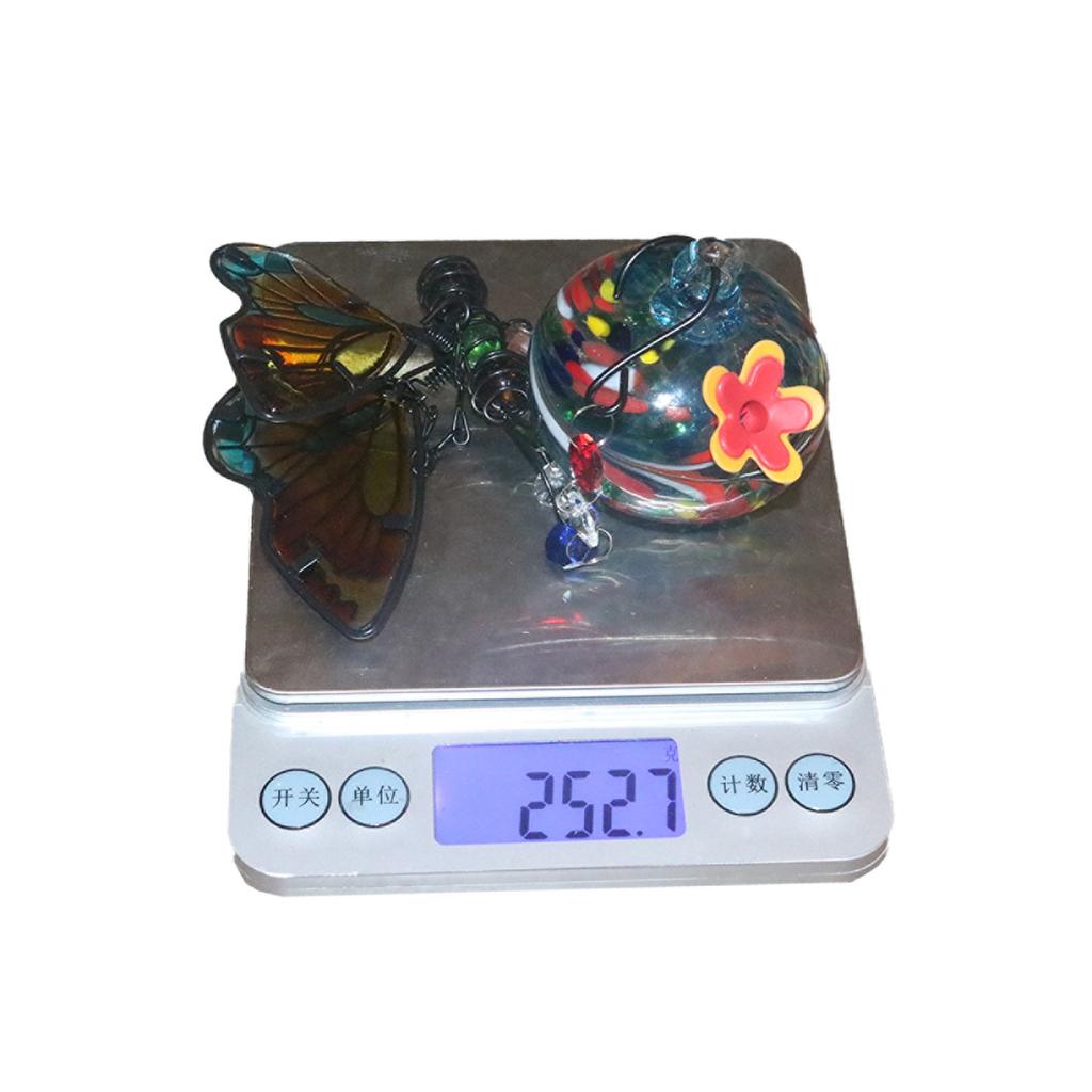 Venkovní zahradní závěsné krmítko pro ptáky ve tvaru motýla z jedné malované skleněné koule