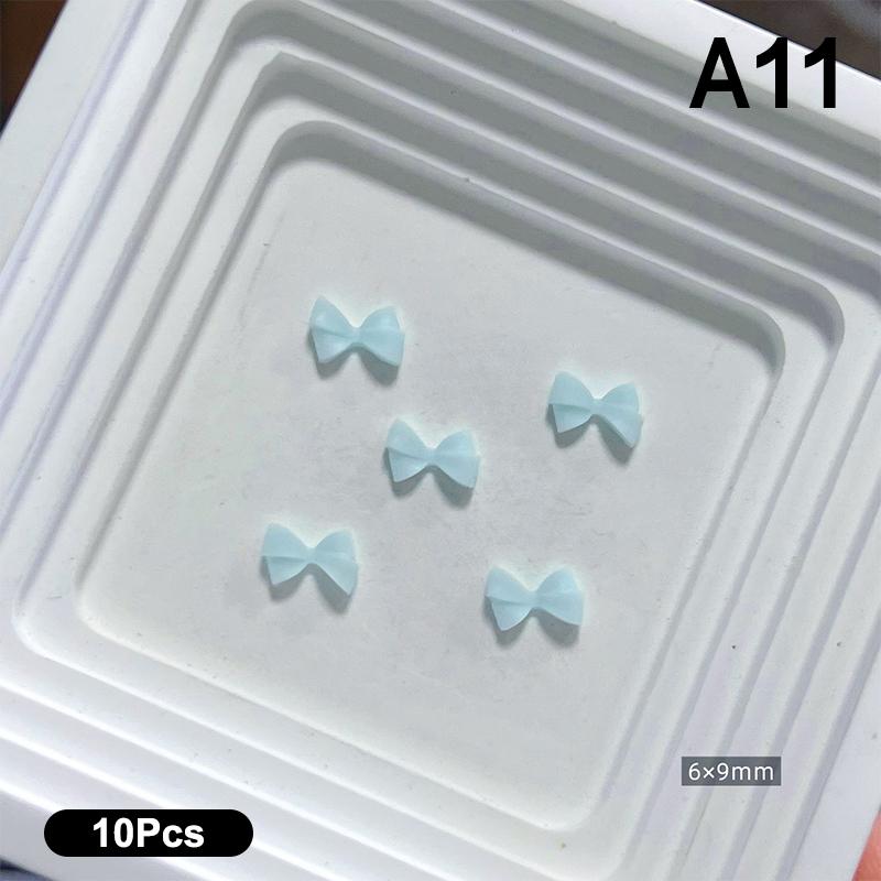 10 Stück Doppellagige Schleifen-Nagelanhänger 3D Süße Band-Schleifen Nagelkunst Strasssteine Mini Harz-Fliege Maniküre Schmuck DIY Teile