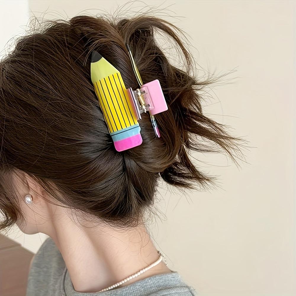 

A creative and cute cartoon pencil grab clip, a colorful and fun shark clip with coiled hair at the back of the head Size fits all