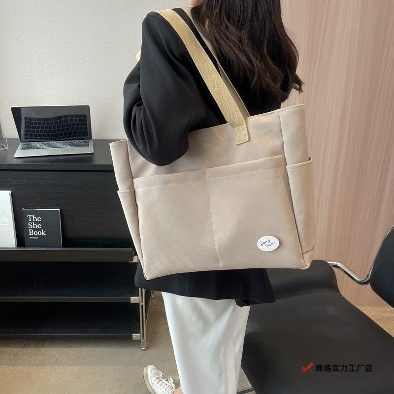 Large capacity lazy wind canvas bag women's solid color niche shoulder handbag casual versatile commuter tote bag
