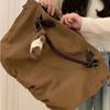 Tote Bag with Large Capacity and Multiple Pockets, for Commuting, with A Single Shoulder Strap and A Slanted Design.