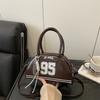 Bag women's new bowling bag fashionable oily leather splicing contrasting color digital decoration portable women's handbag
