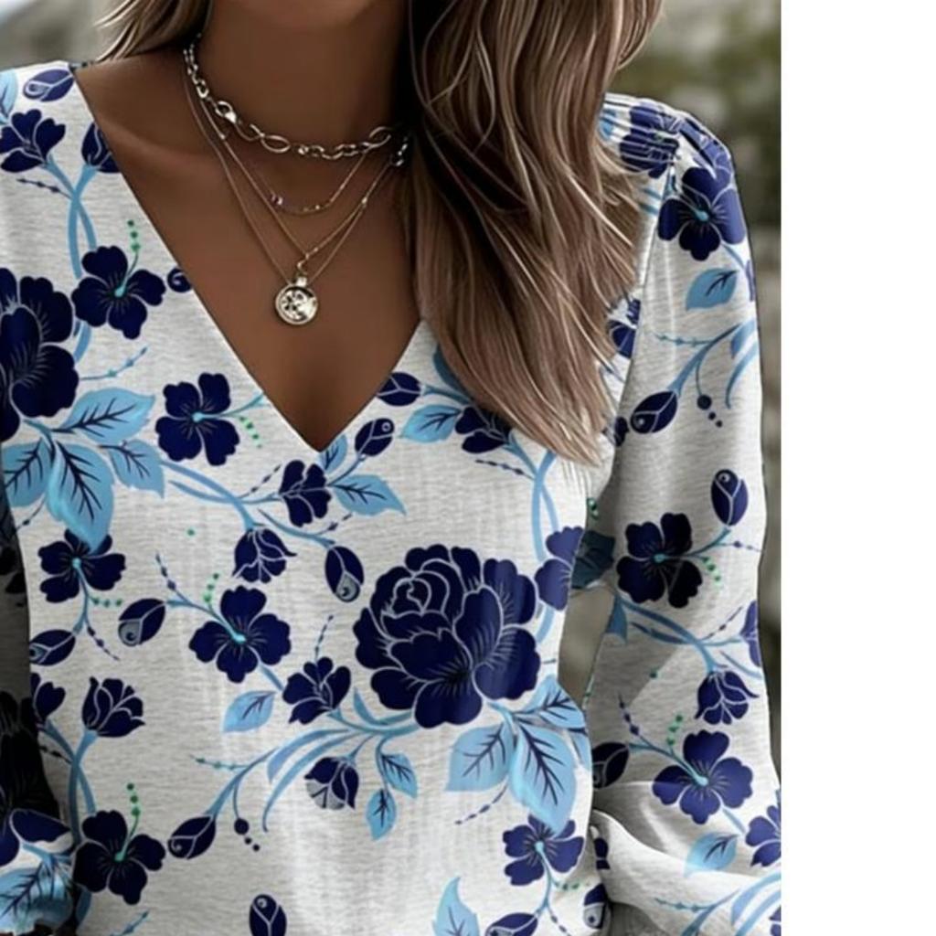 Casual women's puff-sleeved long-sleeved V-neck top. Fashionable loose long-sleeved top, versatile for daily and outdoor walks.