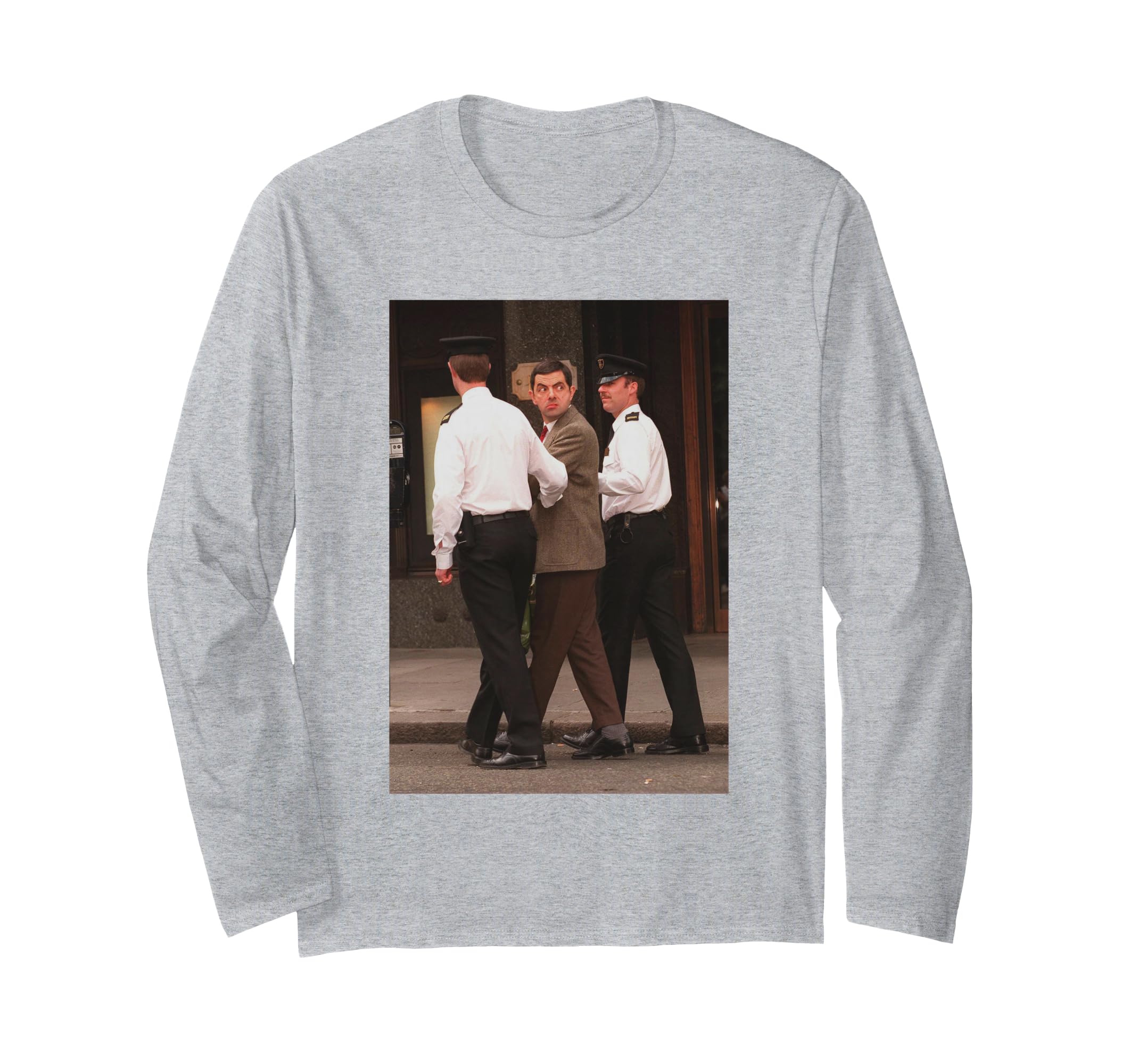 Rowan Atkinson arrested for filming Mr. Bean, 1996, wearing a long-sleeved T-shirt.